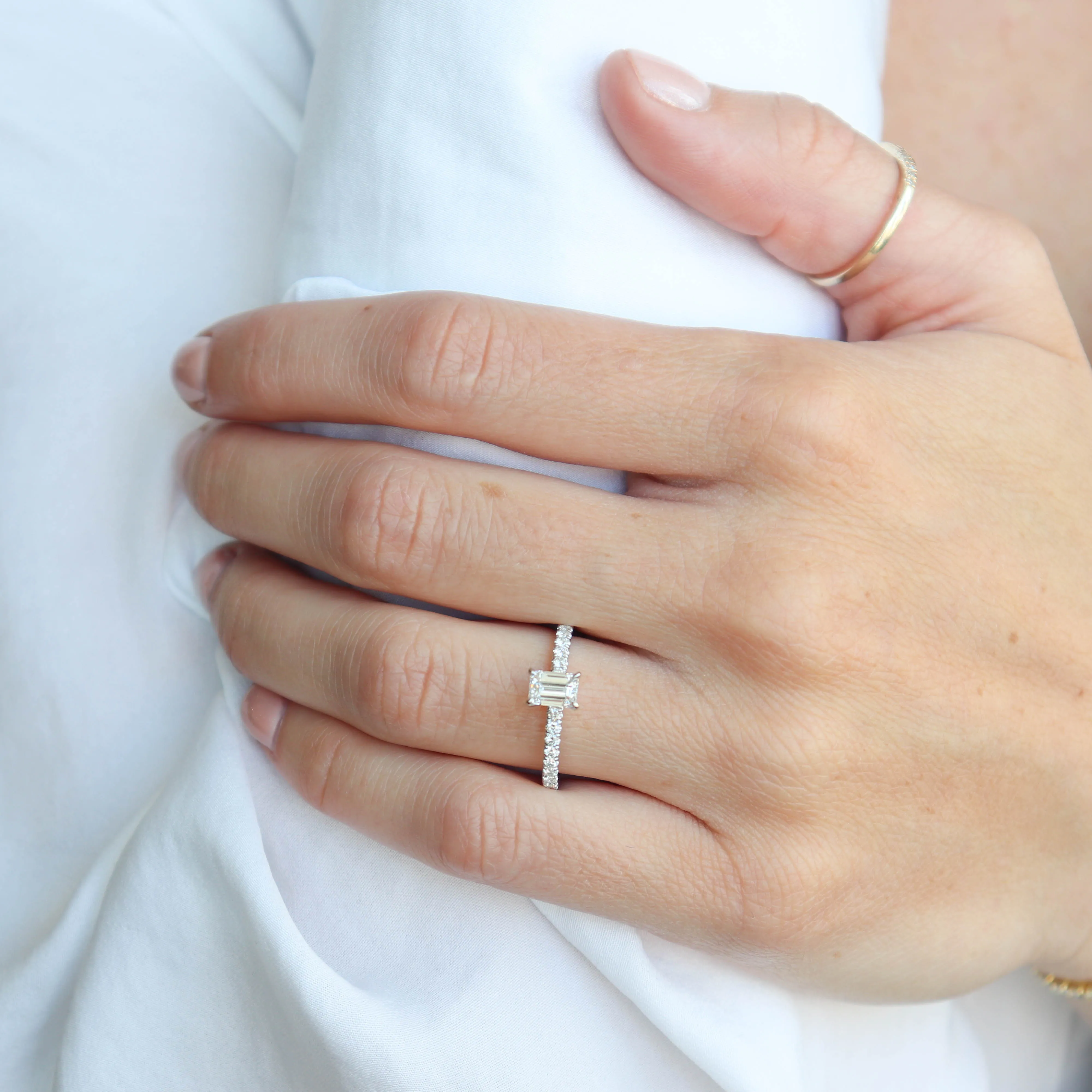 0.60 Emerald Cut Diamond with Accented Band