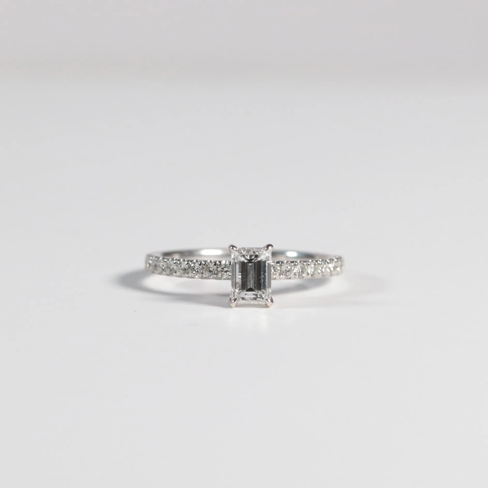 0.60 Emerald Cut Diamond with Accented Band