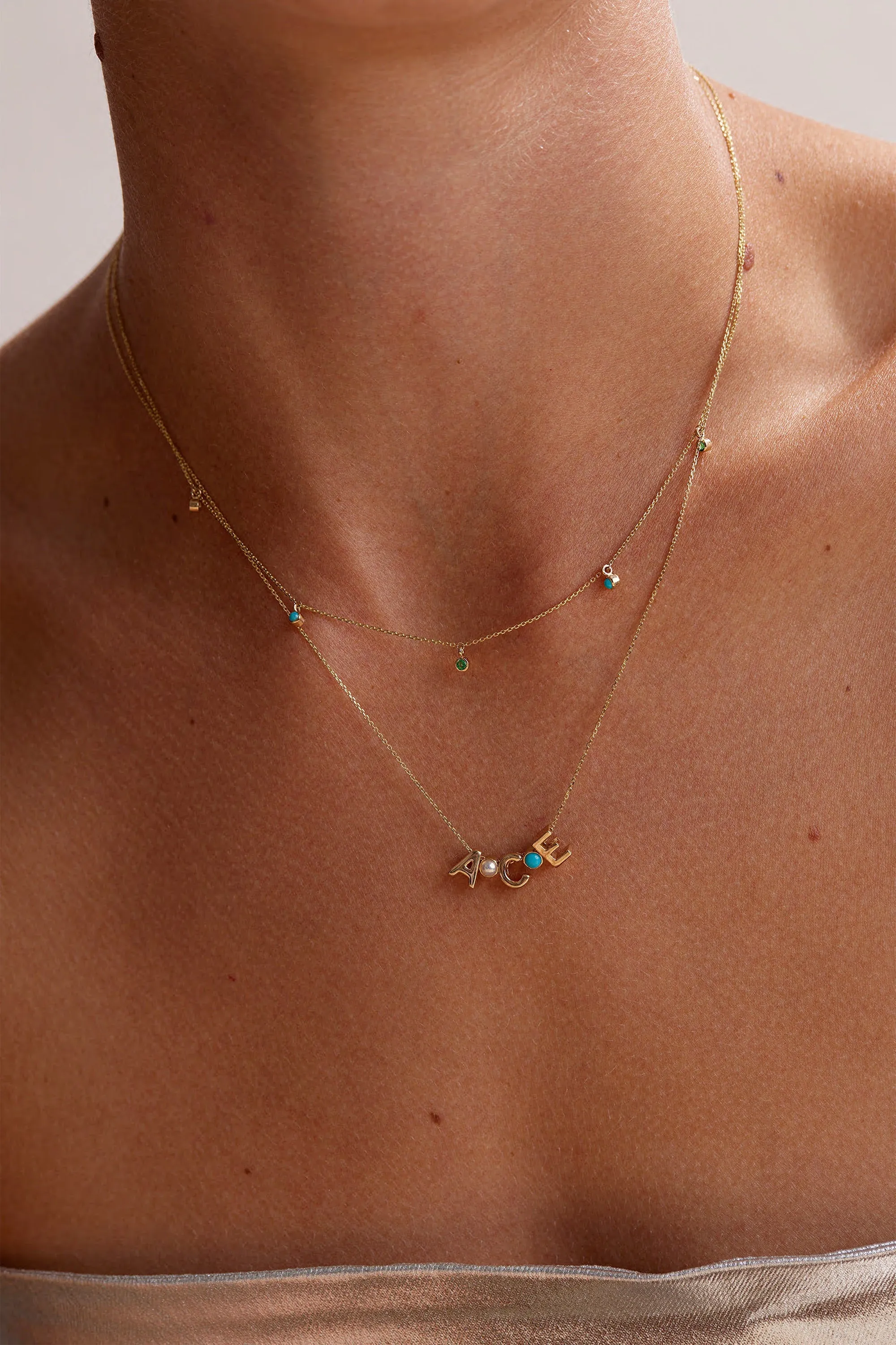 EVERGREEN EMERALD AND TURQUOISE CHARMED NECKLACE